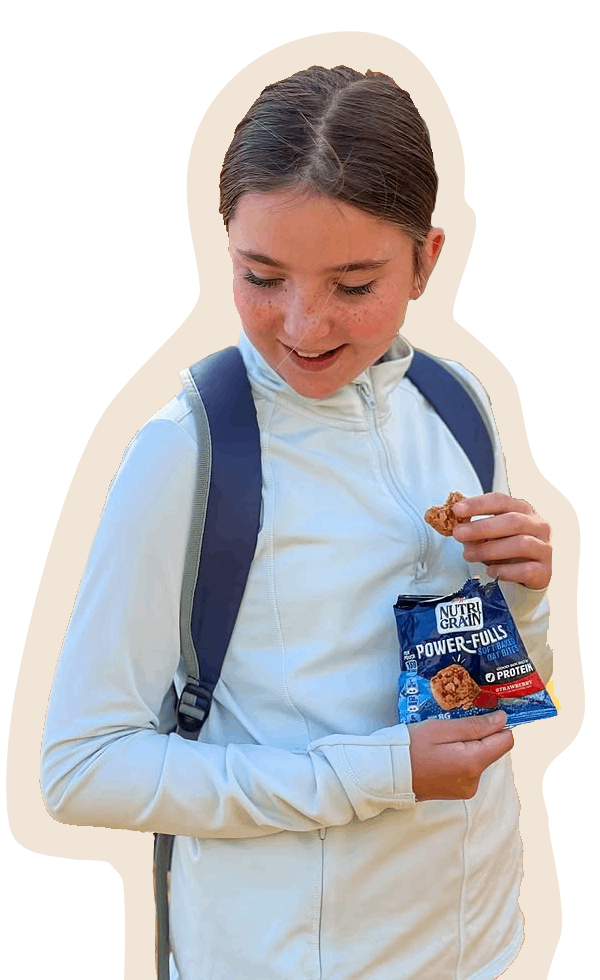 a girl enjoying a Nutri-grain Power-Fulls snack