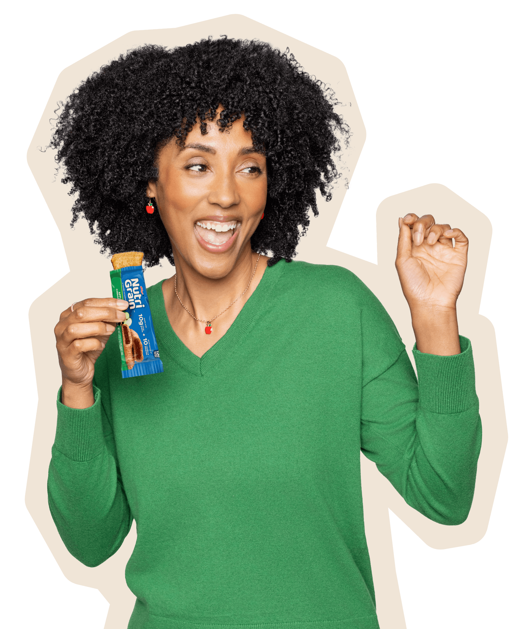 dancing woman in an apple green sweater with a Nutri-Grain bar